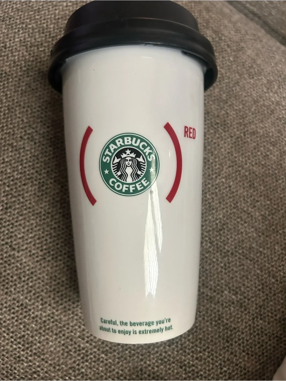 Starbucks 2010 Red Hope product partner ceramic travel mug with snap on lid